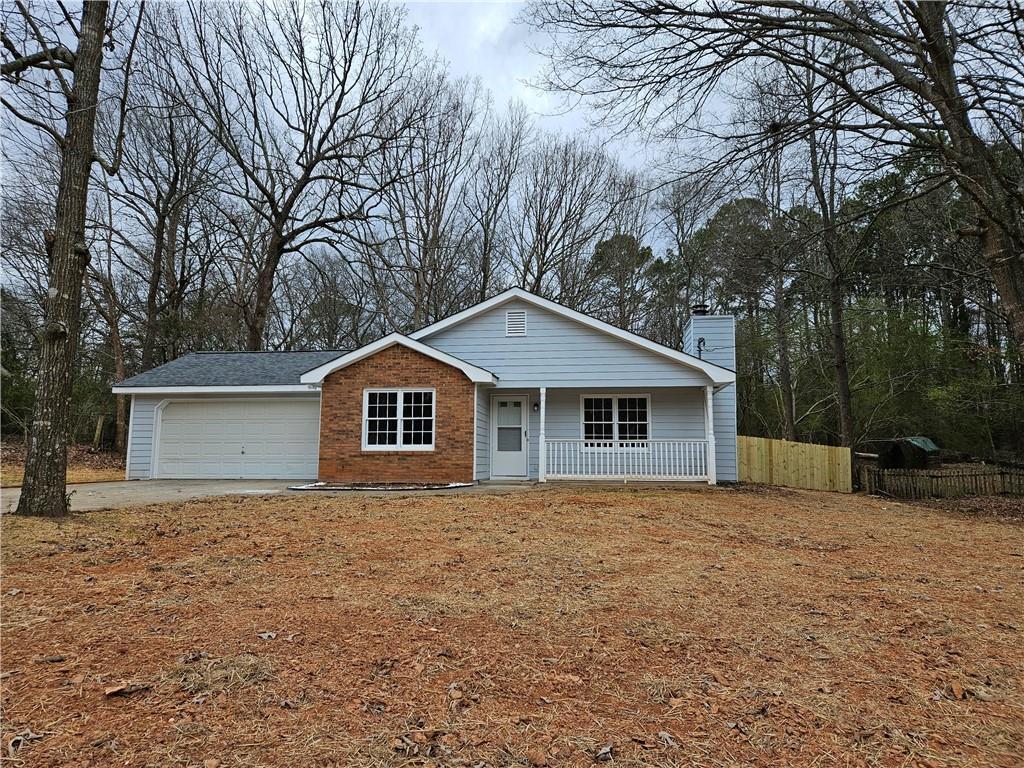 Photo one of 225 E Country Woods Dr Covington GA 30016 | MLS 7344640F