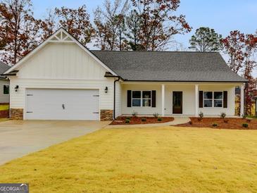 Charming one-story house with white siding, gray roof, and a two-car garage at 8920 Callaway Drive # 94 Rose, Winston, GA 30187