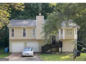 Two-story house with attached two-car garage at 2734 Laurel View Dr, Snellville, GA 30039