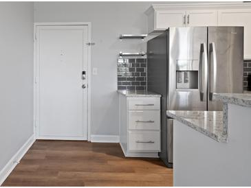 Kitchen with dark gray appliances and granite countertops at 3060 Nw Pharr Cts # 317, Atlanta, GA 30305