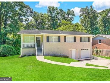 Ranch style home with attached two-car garage at 1863 Rollingwood Se Dr, Atlanta, GA 30316