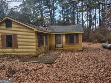 Yellow single story house with a small front porch at 360 Ne Glenn Rd, Conyers, GA 30013