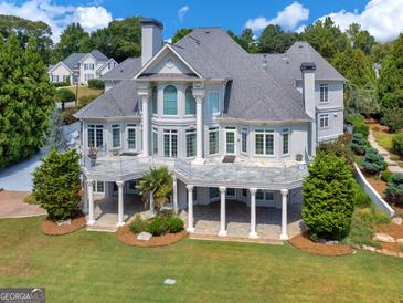 Stunning two-story home with large backyard and patio at 115 Eagles Club Dr, Stockbridge, GA 30281