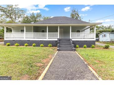 Charming renovated bungalow with a large front porch at 26 Pool Woods Dr, Grantville, GA 30220