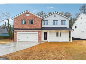 Two-story house with brick and siding exterior at 397 S Gordon Sw Rd, Mableton, GA 30126