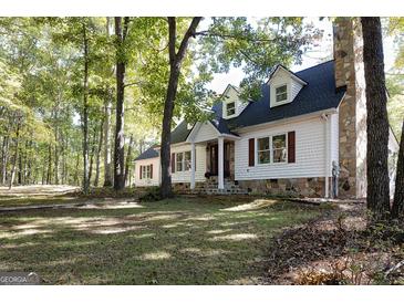 Beautiful home with stone accents and a large yard at 230 Haynes Rd, Moreland, GA 30259