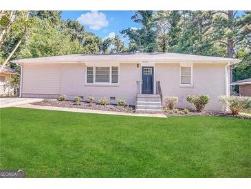Ranch style home with a well-manicured lawn at 2530 Habersham Dr, Decatur, GA 30032