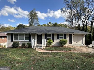 Charming ranch home with a neatly landscaped lawn at 2150 Macon Se Dr, Atlanta, GA 30315
