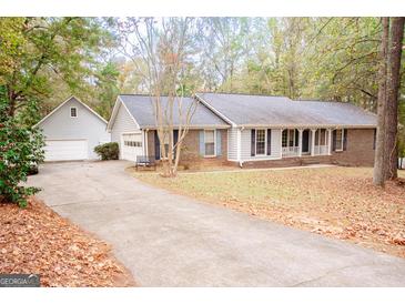 Ranch-style home with a brick facade and attached garage at 130 Greenridge Ct, Fayetteville, GA 30215