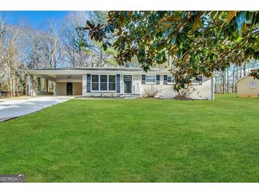 Charming ranch home with a lush green lawn at 3850 Bright Star Rd, Douglasville, GA 30135