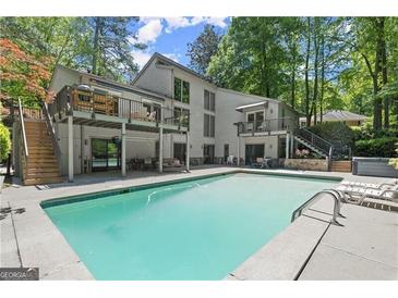 Luxury home with inviting pool and spacious deck at 110 River Ne Lndg, Sandy Springs, GA 30350