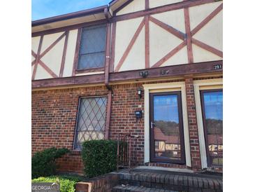 Brick townhouse exterior with double doors at 3290 Abbeywood Dr, Decatur, GA 30034