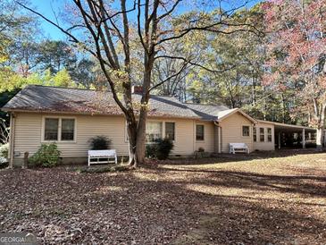 House exterior with landscaping and yard at 5605 Bethlehem Rd, Fairburn, GA 30213
