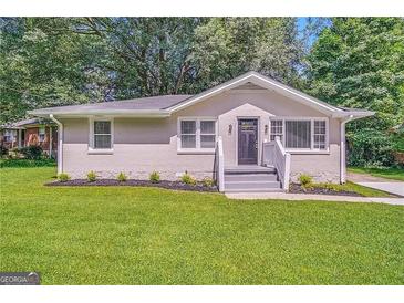 Updated Ranch home with landscaped lawn and front steps at 1764 Thomas Ter, Decatur, GA 30032