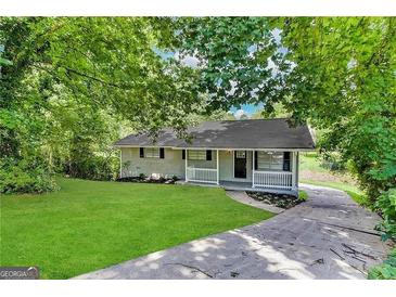 Ranch home with white porch and driveway at 2370 Tiffany Cir, Decatur, GA 30035