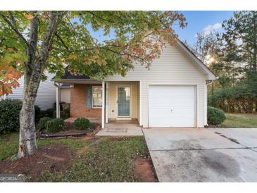 Cute ranch home with attached garage and small front yard at 167 London Dr, Mcdonough, GA 30253