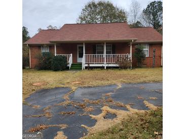 Brick ranch house with front porch and carport at 240 Chambers Rd, Mcdonough, GA 30253