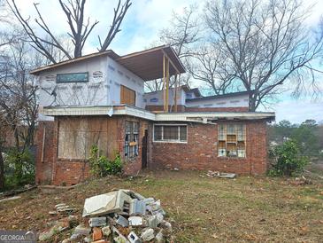 Brick house under construction, with new addition and deck at 2004 Joseph E Boone Nw Blvd, Atlanta, GA 30314