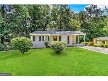 Charming ranch home with a well-manicured lawn at 757 Alfred Nw Rd, Atlanta, GA 30331