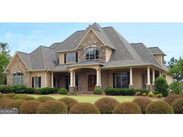 Two-story house with stone accents and a large front porch at 120 National Way, Carrollton, GA 30116