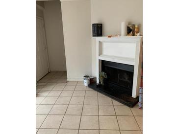 Living room with fireplace and tiled floors at 3806 London Dr, Decatur, GA 30032