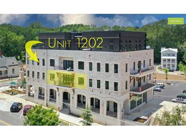 Brick building, unit 1202 highlighted, offers modern design and city views at 8212 Main St # 1202, Woodstock, GA 30188