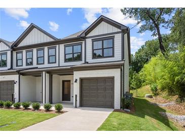 Two-story townhome with attached garage and modern exterior at 1321 Parc Bench Rd, Atlanta, GA 30316