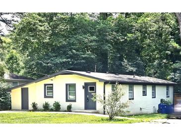 Newly renovated ranch with gray accents and a new door at 164 Polar Rock Sw Dr, Atlanta, GA 30315