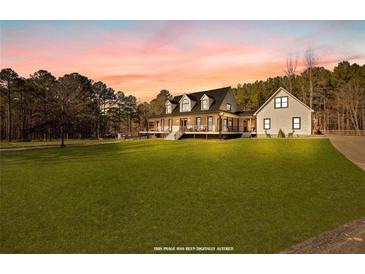 Large two story house with wrap around porch at 401 County Line Rd, Fayetteville, GA 30215