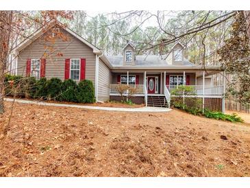 One-story home with red shutters and a wraparound porch at 1117 Campbell Rd, Lawrenceville, GA 30045