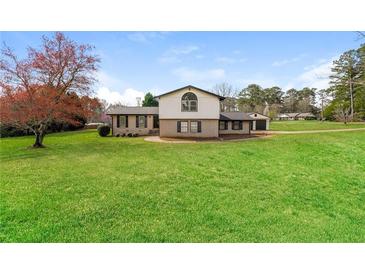 Photo one of 5220 Annie Mitchell Sw Dr Conyers GA 30094 | MLS 7360026