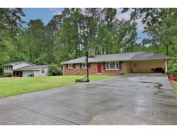 Photo one of 5491 Francis Sw Dr Lilburn GA 30047 | MLS 7380469