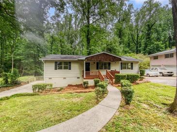 Charming ranch home with a well-maintained front yard and walkway at 4318 Christine Ct, Decatur, GA 30035