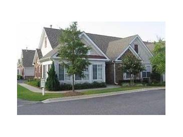 Inviting exterior of charming brick home with mature landscaping at 6133 Malloway Ct, Cumming, GA 30041