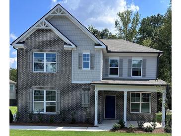 Two-story home with gray siding and brick accents at 558 Abbott Se Ct, Atlanta, GA 30354
