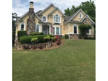Two-story house with stone accents and large yard at 761 Hardage Farm Nw Dr, Marietta, GA 30064