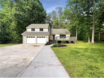 Charming house with a three-car garage and a deck at 2140 Fern Valley Sw Dr, Atlanta, GA 30331