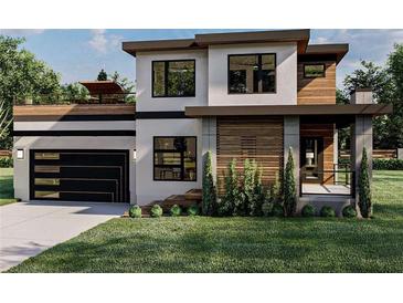 Modern two story home with wood and gray exterior at 4825 Neal Rdg, Atlanta, GA 30349