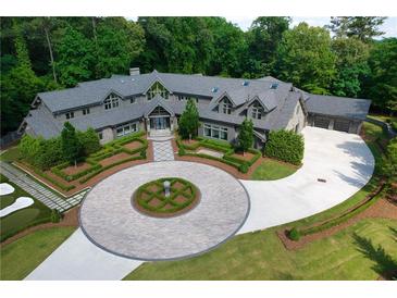 Luxury home with circular driveway and putting green at 2883 W Roxboro Ne Rd, Atlanta, GA 30324