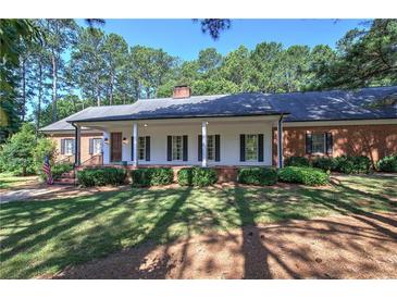 Brick ranch house with a large front porch at 45 Latimer Nw Ln, Cartersville, GA 30121