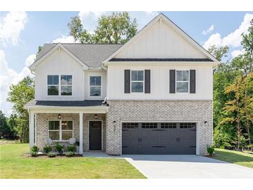 Two-story farmhouse with gray exterior at 3358 Pepperpike Ct, Loganville, GA 30052