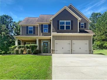 Two-story house with double garage and nicely landscaped lawn at 119 Gatlin Ridge Run, Dallas, GA 30157