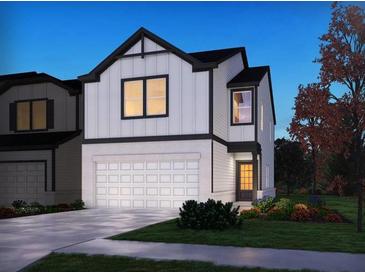 Two-story house with white and black exterior at 1600 Flint River Place Se Se Pl, Smyrna, GA 30126