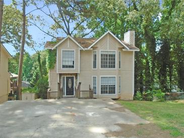 Two-story house with a charming facade and driveway at 1038 Ascot Ct, Riverdale, GA 30296