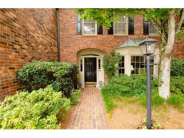 Brick townhouse with a charming front entryway at 3081 Howell Mill Nw Rd # 3, Atlanta, GA 30327