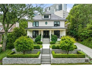 Charming two-story home with well-manicured landscaping at 230 Peachtree Ne Cir, Atlanta, GA 30309
