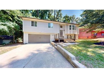 House exterior featuring a gray color scheme and landscaping at 5332 Zachary Dr, Stone Mountain, GA 30083