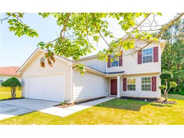 Two-story house with attached garage and manicured lawn at 3139 Redwood Run, Atlanta, GA 30349