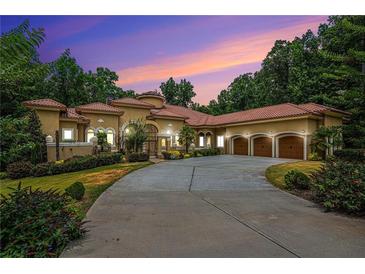 Mediterranean style home with three car garage at 1608 Golden Creek Sw Ct, Conyers, GA 30094