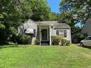 Charming bungalow-style home with a covered porch and well-maintained lawn at 544 Westmeath Sw Dr, Atlanta, GA 30310